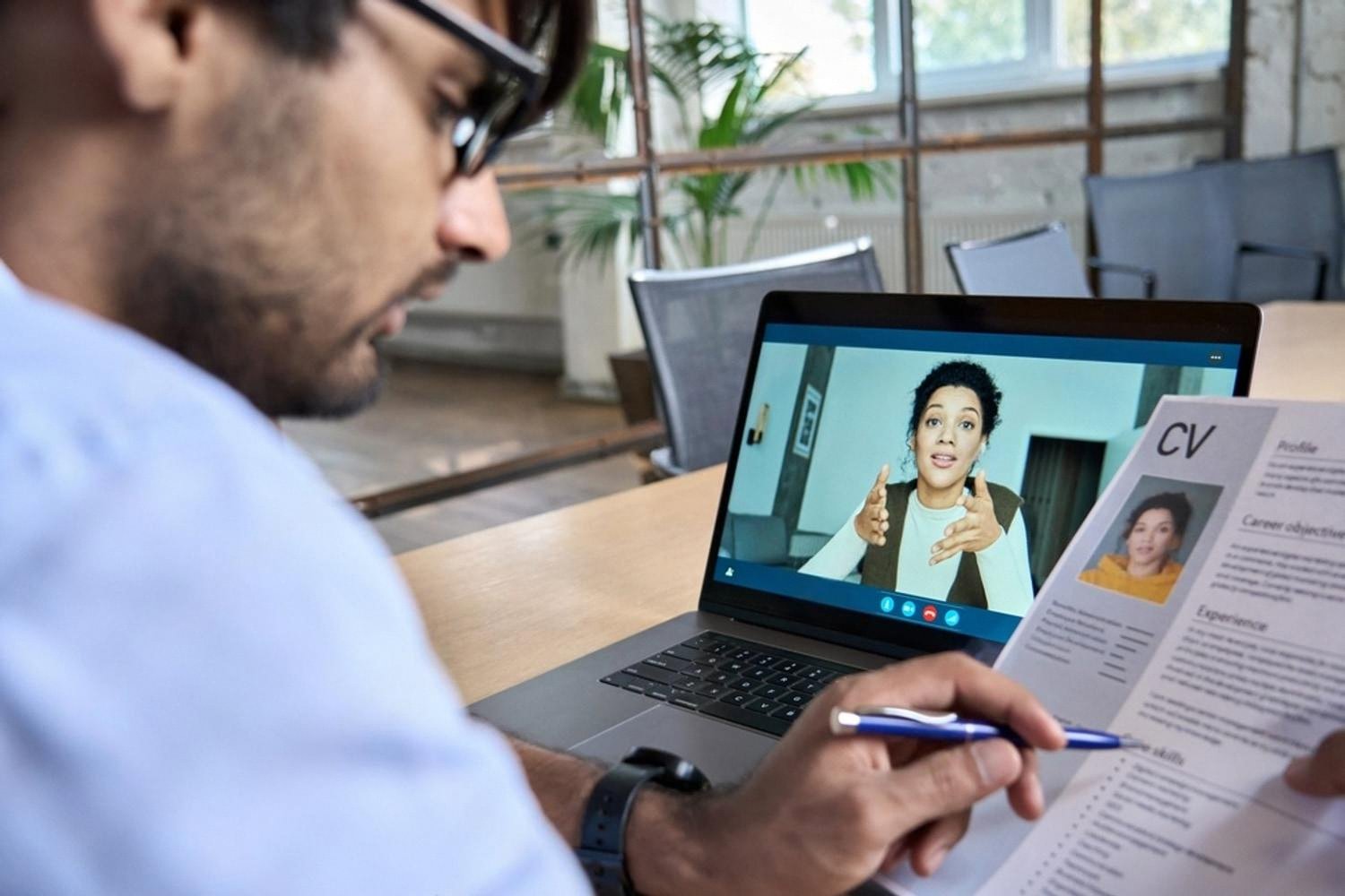 Recruiter in Dubai reviewing a candidate CV during a video interview